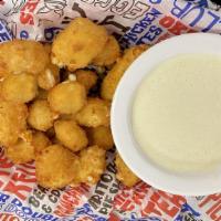 Cheese Curds · Lightly breaded cheese curds. Served with Boom-a-rang Ranch.