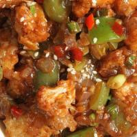 Chili Chicken (65) · Deep-fried chicken cooked with bell pepper, onion, dried chilies and Indian spices.
