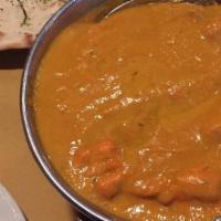 Butter Chicken · chicken cooked in exotic tomato, nuts and butter sauce.