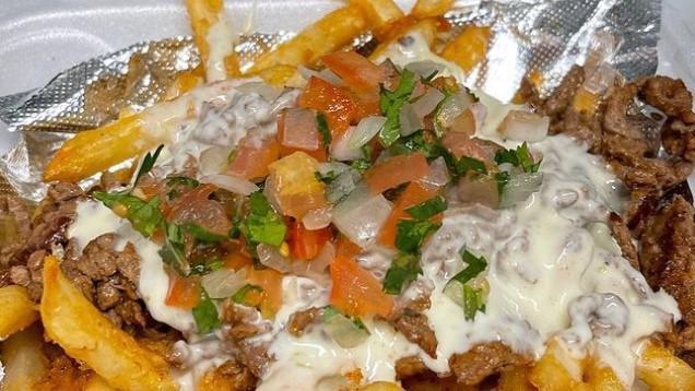 Zapata'S  Fries · Loaded with  pico de gallo, cheese dip, sour cream, jalapenos, and shredded cheese. and your choice of meat
