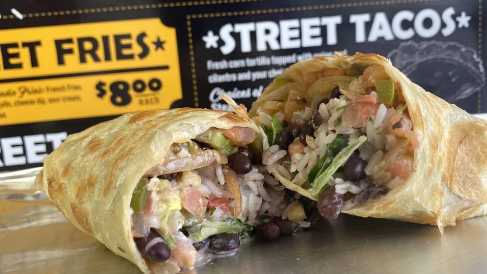 Street Burritos · A flour tortilla, stuffed with rice, black beans, lettuce, cheese sour, cream, green peppers, pico de gallo, and onion.