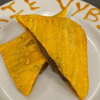 Jamaican Beef Patty · Seasoned ground beef filled in golden flaky dough.