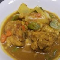 Curry Chicken · Chicken cooked to perfection with turmeric, potatoes, onions, bell peppers, dumplings and gi...