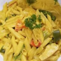 Rasta Pasta · Penne pasta with turmeric, coconut milk, broccoli, bell peppers and onions