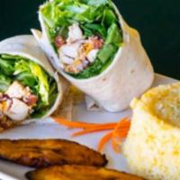 Caribbean Jerk Chicken Wrap · Jerk chicken in tortilla wrap with lettuce, onions, tomatoes, ranch dressing, and cheddar ch...