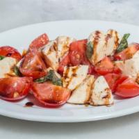 Gluten Free Caprese · Fresh mozzarella, tomatoes, basil, chili, EVOO, Balsamic