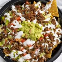 Nachos · We Start by placing fresh homemade chips, than we add Beans, Cheese, your Protein Choice, So...