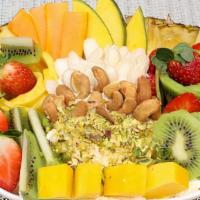 Fruit Salad · Seasonal fresh fruits topped with Kishta, cashew, almonds, and honey.