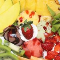 Royal Fruit Salad · Seasonal fresh fruits topped with Raspberry and Mango Gelato.