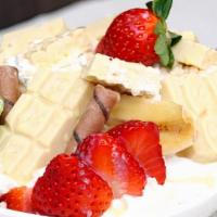 Crunchy Fruit Salad · Rice Krispies, strawberry, banana, Melt n Dip special cream and topped with whipped cream