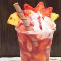 Tahiti · fresh strawberry juice with chunks of Banana, strawberry and pineapple topped with strawberr...