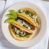 Street Taco · Favorite. Corn tortilla topped off with your choice of meat, cilantro and onions. Side of li...