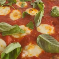 Margherita Pizza · Hand crushed plum tomatoes, fresh mozzarella fresh basil and olive oil