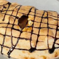 Buckeye Calzone · Homemade peanut butter with Ghirardelli chocolate inside, and chocolate drizzle on top.