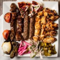 Basha Family Tray · Two beef kabob, two chicken tawook, two beef kafta, Served with a side of rice, fattoush, ga...