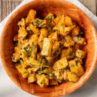 Spicy Potatoes · Fried potatoes tossed in garlic, cilantro and sriracha sauce.