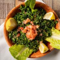 Tabouli · Parsley, tomatoes, onion, mint, lemon and olive oil.