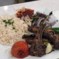 Charbroiled Lamb Chops · Four pieces. Served with pita bread, salad, and rice.