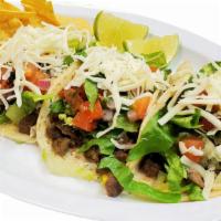 Street Tacos Trio Deluxe · Soft corn flour tortilla filled with your choice of meat prepared with lettuce, sour cream, ...