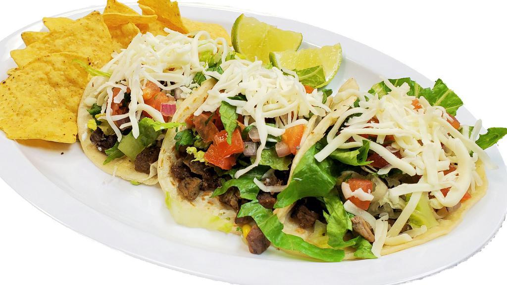 Street Tacos Trio Deluxe · Soft corn flour tortilla filled with your choice of meat prepared with lettuce, sour cream, and cheese. With chips included.