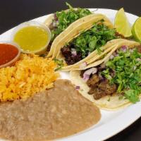 Taco Platter · Tacos with your choice of meat, mexican rice and your choice of beans. Salsa on the side.
