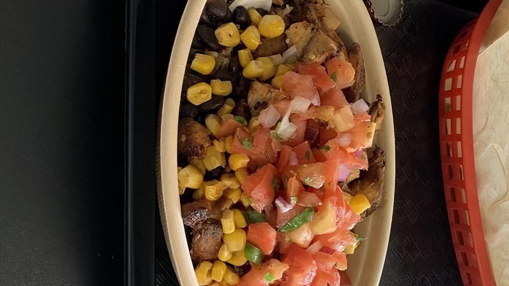 Burrito Bowl · Bowl with with mexican rice, lettuce, salsa, pico, corn, sour cream, cheese and your choice of meat. With chips included. Vegetarian option available. Everything above plus guacamole and fajitas.