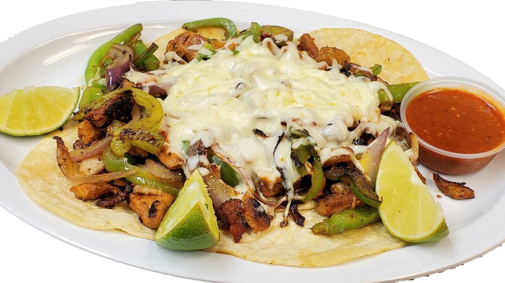 Alambres · 5 tortillas topped with your choice of meat, sautéed with bacon, green peppers, onions and topped with melted cheese.
