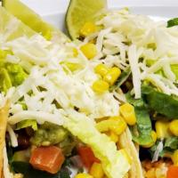 Vegetarian Tacos · Soft corn or flour tortilla prepared with mexican rice, black beans, sour cream, cheese, let...