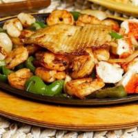 Fajitas Del Mar · Shrimp, tilapia, scallops, imitation crab grilled with onions, green peppers, tomatoes serve...