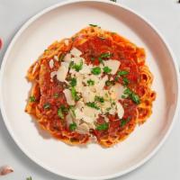 Bussin' Bolognese Fettuccine · Fettuccine cooked al dente served with house made meat sauce and delicious parmigiano reggia...