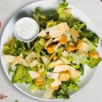 Caesar Salad · Crisp romaine lettuce, parmesan cheese and crunchy croutons. Served with caesar dressing on ...