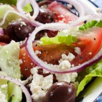 Greek Salad · House salad tossed with olives, beets, peppercini, feta cheese and our homemade olive oil an...