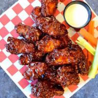 Bone-In Wings Small · Tossed in your choice of sauce served with celery, and a side of ranch or bleu cheese dressi...