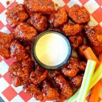 Boneless Wings Small · Tossed in your choice of sauce served with celery, and a side of ranch or bleu cheese dressi...