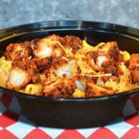 Nashville Hot Mac 'N Cheese · Creamy cheddar mac and cheese topped with crispy Nashville chicken tenders, bacon, roasted g...