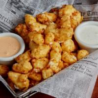 House Made Cheese Curds · A shareable portion of state fair style cheese curds lightly battered and served with ranch ...