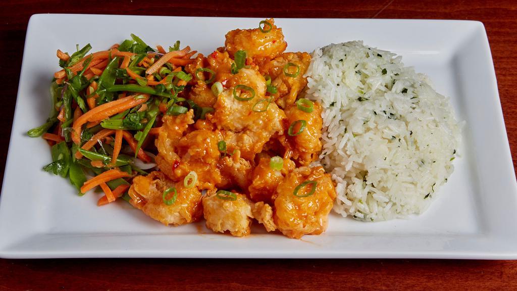Bang Bang Shrimp · Succulent shrimp lightly dusted and golden fried. Tossed in our spicy bang bang sauce. Accompanied with Asian slaw, cilantro rice, and finished with fresh scallion.