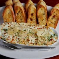 Crab Artichoke Dip · Crab meat, artichoke hearts, fresh spinach, green onions, garlic, spices and parmesan. Toppe...