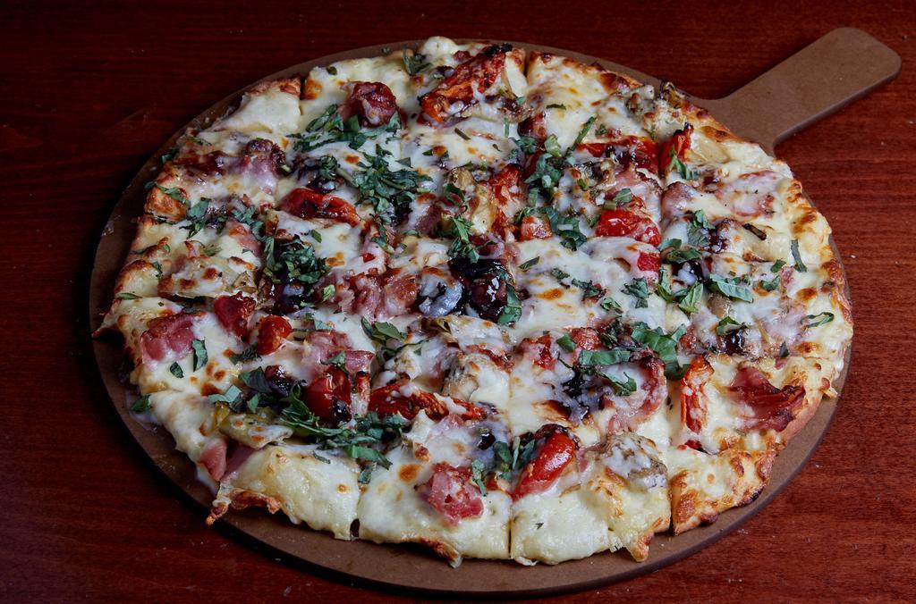 Tavern Brie Pizza · Artisan crust brushed with a brie spread. Topped with shaved prosciutto ham, fire roasted artichoke, roasted tomato, mozzarella, balsamic red onion jam, and basil chiffonade.