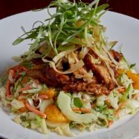 All Thai'D Up Salad · Crispy sesame chicken stix, cut and tossed in Thai peanut sauce then served over a bed of ic...