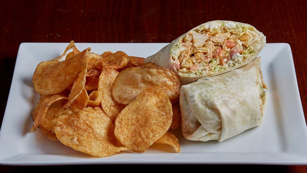Buffalo Chicken Wrap · Grilled chicken tossed in buffalo sauce with shredded iceberg lettuce, bleu cheese crumbles, jalapeño ranch dressing, pepper jack cheese, crispy wonton strips and tomatoes in a flour tortilla.