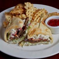 Grilled Gyro On Naan · Lamb beef gyro on warm naan bread with shredded lettuce, tomato, red onion, cucumber planks,...