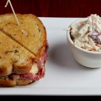 Reuben · Thinly shaved corned beef topped with sauerkraut, swiss cheese and house made russian dressi...