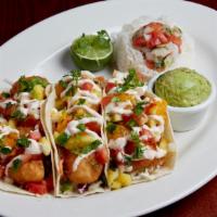 Fish Tacos · Our cod filets, lightly battered and fried, served in warm flour tortillas with fresh cilant...