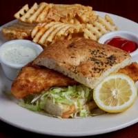 Tavern Fish Sandwich · A generous filet of wild-caught Canadian haddock dipped in tavern batter, served with shredd...