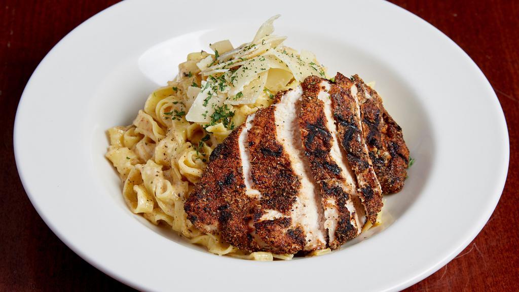 Cajun Chicken Fettuccine Alfredo · Fettuccine noodles tossed in our creamy alfredo sauce,garnished with parmesan cheese and chopped parsley. Topped with a charbroiled Cajun chicken breast.