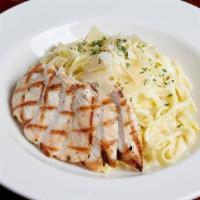 Chicken Fettuccine Alfredo · Fettuccine noodles tossed in our creamy alfredo sauce with grilled chicken. Finished with sh...
