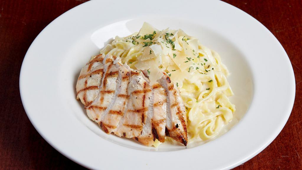 Chicken Fettuccine Alfredo · Fettuccine noodles tossed in our creamy alfredo sauce with grilled chicken. Finished with shaved parmesan and parsley. Substitute sautéed shrimp.