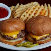 Kids Mini Cheeseburgers · Two mini burgers topped with American cheese and served on grilled slider buns.  Served with...