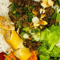 Bun Thit Nuong Cha Gio · Grilled pork, egg roll and vermicelli. Served with Asian mixed green and lime chilli fish sa...
